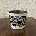 Handmade ceramic mug with black and white floral pattern, food-safe pottery for coffee or tea